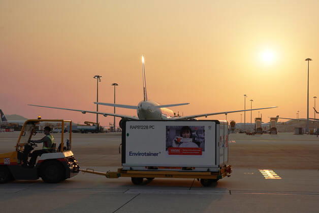 (210219) -- HONG KONG, Feb. 19, 2021 -- Staff members transport the vaccines at the Hong Kong International Airport in Hong Kong, south China, Feb. 19, 2021. The first batch of mainland-manufactured COVID-19 vaccines arrived in Hong Kong on Friday afternoon, which, as the first vaccines available here, will enable the financial hub to start inoculating its residents next week. ) CHINA-HONG KONG-COVID-19-VACCINE-ARRIVAL (CN) LixGang 