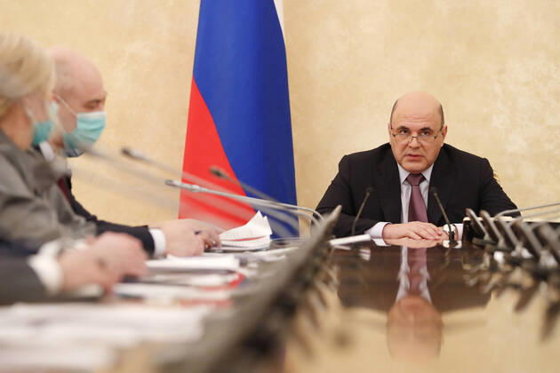 MOSCOW, RUSSIA - FEBRUARY 20, 2021: Russia s Prime Minister Mikhail Mishustin (R) during a meeting on circulation of vaccines at the House of the Russian Government. Dmitry Astakhov POOL TASS  TS0F748C