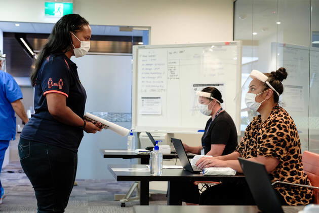 (210220) -- AUCKLAND, Feb. 20, 2021 () -- A border worker registers before receiving a dose of the COVID-19 vaccine in Auckland, New Zealand, Feb. 20, 2021. New Zealand s COVID-19 vaccination official roll-out began on Saturday when border workers received their first vaccinations in Auckland s quarantine facility. () NEW ZEALAND-AUCKLAND-COVID-19-VACCINATION Xinhua 
