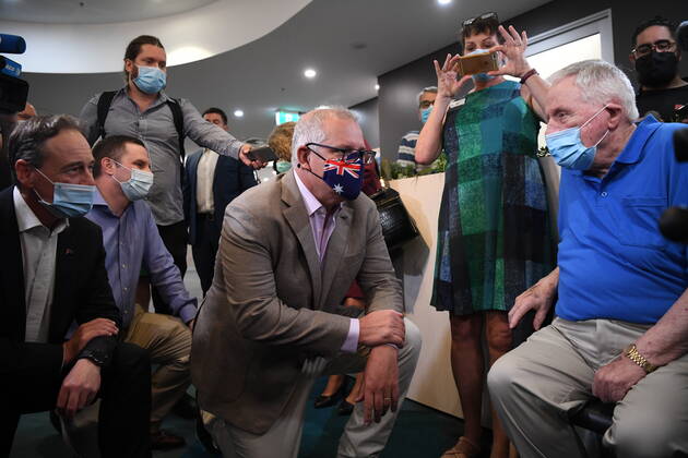 SCOTT MORRISON COVID19 VACCINATION, Australian Prime Minister Scott Morrison speaks with Aged care resident John Healy ahead of him receiving the second Codid-19 vaccine in Australia during a visit to Castle Hill Medical Centre to preview the COVID-19 vaccination program on Sunday, February 21, 2021. ( NO ARCHIVING, EDITORIAL USE ONLY, NO USE IN BOOKS WITHOUT CONSENT SYDNEY NSW AUSTRALIA Copyright: xJOELxCARRETTx 20210221001522034068