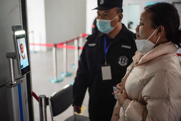 (210221) -- BEIJING, Feb. 21, 2021 -- A woman registers before the COVID-19 vaccination at a vaccination site in Daxing District of Beijing, capital of China, Feb. 21, 2021. Daxing District of Beijing has launched a local mass vaccination drive on Feb. 17, setting up 26 sites in the region for the mass vaccination. ) CHINA-BEIJING-DAXING-COVID-19-VACCINATION (CN) PengxZiyang 