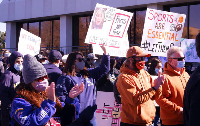 February 21, 2021, ALBUQUERQUE, NEW MEXICO, USA: 022121.Parents, athletes and supporters hold signs to protest the APS Board decision to cancel the season for all athletic activities .Photographed on Sunday February 21, 2021. ALBUQUERQUE USA - ZUMAab1_ 20210221_zaf_ab1_002 Copyright: xAdolphexPierre-Louis Journalx
