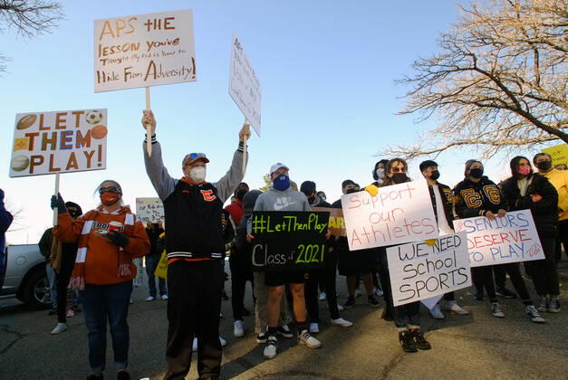February 21, 2021, ALBUQUERQUE, NEW MEXICO, USA: 022121.Parents, athletes and supporters hold signs to protest the APS Board decision to cancel the season for all athletic activities .Photographed on Sunday February 21, 2021. ALBUQUERQUE USA - ZUMAab1_ 20210221_zaf_ab1_004 Copyright: xAdolphexPierre-Louis Journalx