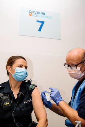 SA COVID19 VACCINE ROLLOUT, Front-line worker SAPOL Senior Sergeant Amanda Kuchel receives the Pfizer Vaccine from a COVID-19 Vaccinator Health Care Worker at the Royal Adelaide Hospital in Adelaide, Monday, February 22, 2021. Australia will begin its roll out of the Pfizer coronavirus vaccine on Monday, the country s most complicated logistical exercise to date.( NO ARCHIVING, EDITORIAL USE ONLY, NO USE IN BOOKS WITHOUT CONSENT ADELAIDE SA AUSTRALIA Copyright: xMORGANxSETTEx 20210222001522254689