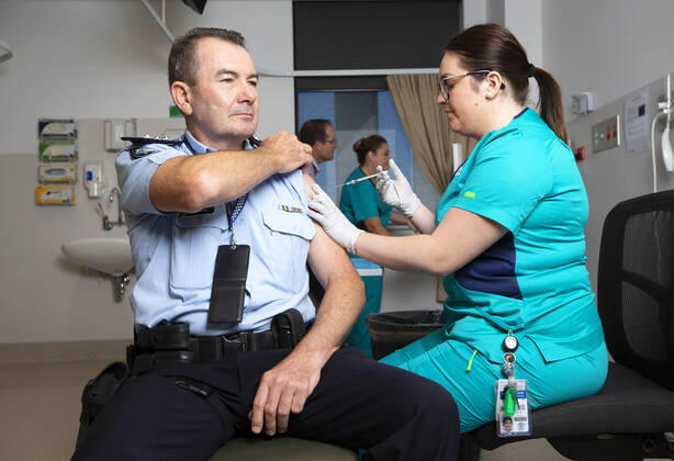 QLD COVID19 VACCINE ROLLOUT, Police Inspector Owen Hortz (left) is administered a Pfizer coronavirus vaccination by a clinical nurse at the Gold Coast University Hospital on the Gold Coast, Monday, February 22, 2021. Australia will begin its roll out of the Pfizer coronavirus vaccine on Monday, the country s most complicated logistical exercise to date. ( NO ARCHIVING, EDITORIAL USE ONLY, NO USE IN BOOKS WITHOUT CONSENT GOLD COAST QLD AUSTRALIA  Copyright: xNIGELxHALLETTx 20210222001522281797
