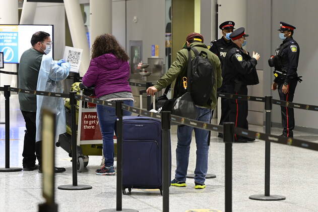 February 22, 2021, Toronto, on, Canada: Travellers, who are not affected by new quarantine rules, arrive at Terminal 3 at Pearson Airport in Toronto early Monday, February 22, 2021. Prime Minister Justin Trudeau announced that all travellers entering Canada by air would have to quarantine in a hotel for three days at their own expense starting later today. Toronto Canada - ZUMAc35_ 20210222_zaf_c35_002 Copyright: xFrankxGunnx