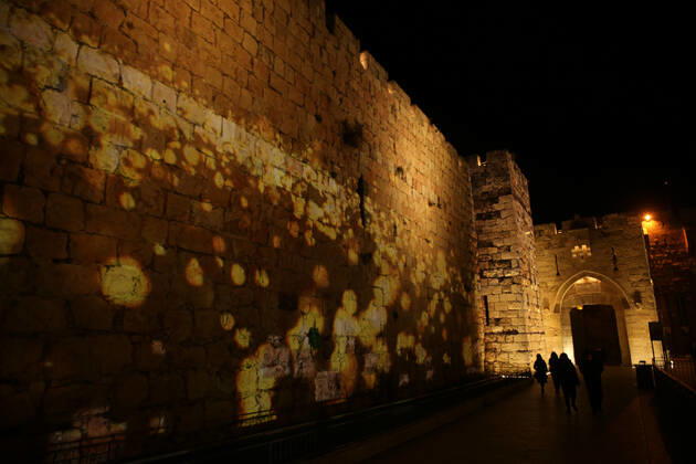 (210222) -- JERUSALEM, Feb. 22, 2021 -- A lightshow as part of the Follow the Lights event launched by Jerusalem s municipal authority amid COVID-19 pandemic is displayed over the wall of Jerusalem s Old city on Feb. 21, 2021. (Photo by Xinhua) MIDEAST-JERUSALEM-LIGHT SHOW MuammarxAwad