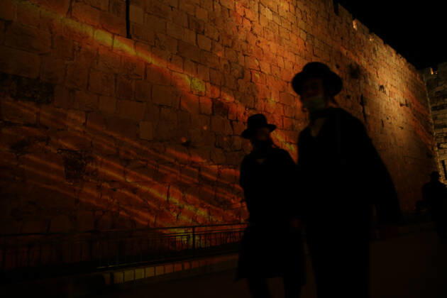 (210222) -- JERUSALEM, Feb. 22, 2021 -- A lightshow as part of the Follow the Lights event launched by Jerusalem s municipal authority amid COVID-19 pandemic is displayed over the wall of Jerusalem s Old city on Feb. 21, 2021. (Photo by Xinhua) MIDEAST-JERUSALEM-LIGHT SHOW MuammarxAwad