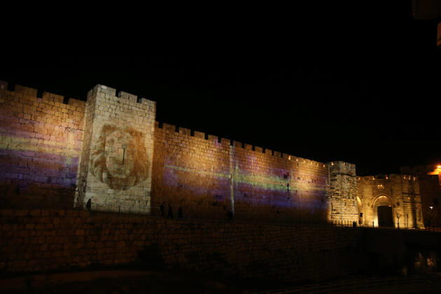 (210222) -- JERUSALEM, Feb. 22, 2021 -- A lightshow as part of the Follow the Lights event launched by Jerusalem s municipal authority amid COVID-19 pandemic is displayed over the wall of Jerusalem s Old city on Feb. 21, 2021. (Photo by Xinhua) MIDEAST-JERUSALEM-LIGHT SHOW MuammarxAwad 