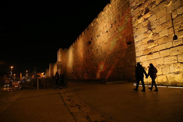 (210222) -- JERUSALEM, Feb. 22, 2021 -- A lightshow as part of the Follow the Lights event launched by Jerusalem s municipal authority amid COVID-19 pandemic is displayed over the wall of Jerusalem s Old city on Feb. 21, 2021. (Photo by Xinhua) MIDEAST-JERUSALEM-LIGHT SHOW MuammarxAwad