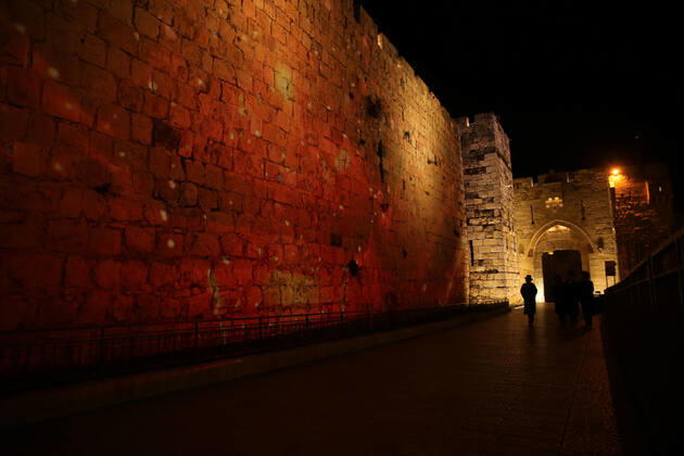(210222) -- JERUSALEM, Feb. 22, 2021 -- A lightshow as part of the Follow the Lights event launched by Jerusalem s municipal authority amid COVID-19 pandemic is displayed over the wall of Jerusalem s Old city on Feb. 21, 2021. (Photo by Xinhua) MIDEAST-JERUSALEM-LIGHT SHOW MuammarxAwad