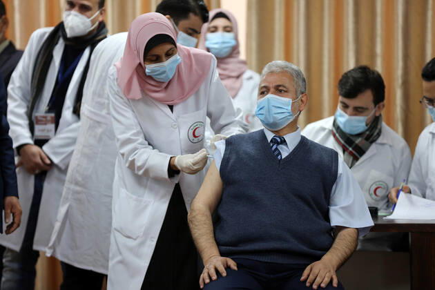 February 22, 2021, Gaza city, Gaza Strip, Palestinian Territory: Palestinian doctors receive the first dose of a COVID-19 vaccine at the Ministry of Health, in Gaza city, on February 22, 2021. Around 20,000 coronavirus vaccine doses from the UAE arrived in Gaza Sunday Gaza city Palestinian Territory - ZUMAap3_ 20210222_zaf_ap3_001 Copyright: xAshrafxAmrax