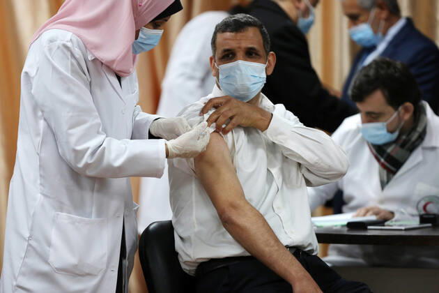 February 22, 2021, Gaza city, Gaza Strip, Palestinian Territory: Palestinian doctors receive the first dose of a COVID-19 vaccine at the Ministry of Health, in Gaza city, on February 22, 2021. Around 20,000 coronavirus vaccine doses from the UAE arrived in Gaza Sunday Gaza city Palestinian Territory - ZUMAap3_ 20210222_zaf_ap3_005 Copyright: xAshrafxAmrax