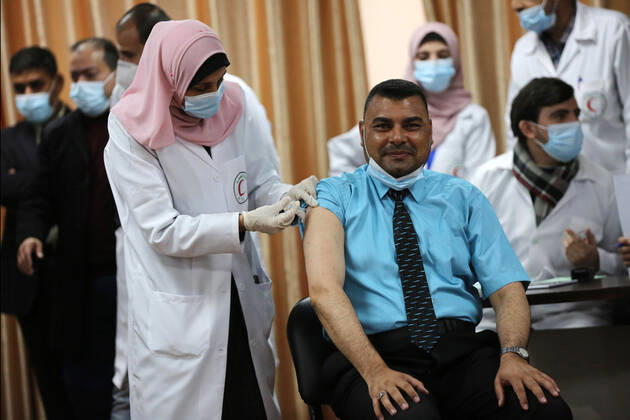 February 22, 2021, Gaza city, Gaza Strip, Palestinian Territory: Palestinian doctors receive the first dose of a COVID-19 vaccine at the Ministry of Health, in Gaza city, on February 22, 2021. Around 20,000 coronavirus vaccine doses from the UAE arrived in Gaza Sunday Gaza city Palestinian Territory - ZUMAap3_ 20210222_zaf_ap3_008 Copyright: xAshrafxAmrax