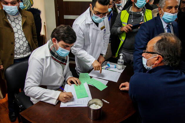 February 22, 2021, Gaza city, Gaza Strip, Palestinian Territory: Palestinian doctors receive the first dose of a COVID-19 vaccine at the Ministry of Health, in Gaza city, on February 22, 2021. Around 20,000 coronavirus vaccine doses from the UAE arrived in Gaza Sunday Gaza city Palestinian Territory - ZUMAap3_ 20210222_zaf_ap3_079 Copyright: xMohammedxSalemx