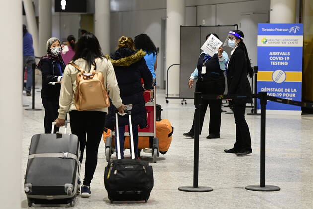 February 22, 2021, Toronto, on, Canada: Travellers, who are not affected by new quarantine rules, arrive at Terminal 3 at Pearson Airport in Toronto early Monday, February 22, 2021. Prime Minister Justin Trudeau announced that all travellers entering Canada by air would have to quarantine in a hotel for three days at their own expense starting later today. Toronto Canada - ZUMAc35_ 20210222_zaf_c35_008 Copyright: xFrankxGunnx