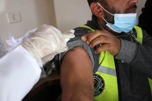 February 22, 2021, Gaza city, Gaza Strip, Palestinian Territory: Palestinian doctors receive the first dose of a COVID-19 vaccine at the Ministry of Health, in Gaza city, on February 22, 2021. Around 20,000 coronavirus vaccine doses from the UAE arrived in Gaza Sunday Gaza city Palestinian Territory - ZUMAap3_ 20210222_zaf_ap3_099 Copyright: xAshrafxAmrax