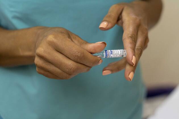 February 22, 2021, Firmat, Santa Fe, Argentina: Nurse Monica Arrieta checks a single dose vial of the Russian Sputnik V vaccine against COVID-19 to be applied on a healthcare worker, as Argentina carries-on with the vaccination campaign. Firmat Argentina - ZUMAm105 20210222_zaf_m105_010 Copyright: xPatricioxMurphyx