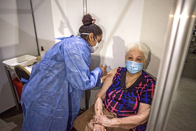 February 22, 2021, Buenos Aires, Federal Capital, Argentina: The Government of the City of Buenos Aires began this morning with the second stage of the vaccination plan against COVID-19. The first delivery of 40,000 Oxford-AstraZeneca Covishield vaccines, manufactured in India, will be aimed at adults over 80 years of age and those residing in nursing homes. To begin with, this Monday is scheduled to serve approximately 5,000 people..Mrs. Norida, 82, of Venezuelan nationality, with permanent residence in the City of Buenos Aires, receives the Covishield vaccine Buenos Aires Argentina - ZUMAa179 20210222_zap_a179_002 Copyright: xRobertoxAlmeidaxAveledox