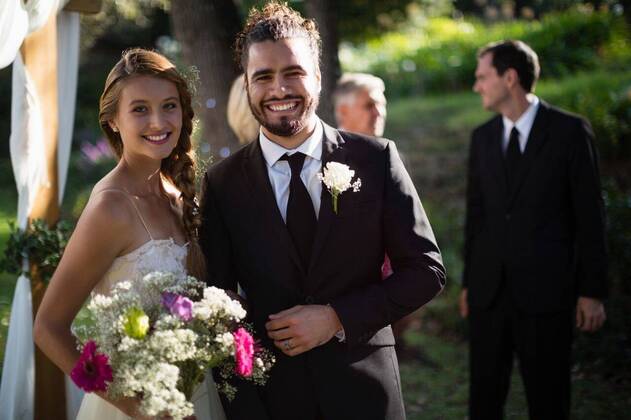 Happy bride and groom standing in park Portrait of happy bride and groom standing in park, model released, , property released, Cape Town, South Africa, 2017-05-01T23:00:00.000Z, 1050946.jpg, sunny, summertime, park, courtyard, wedding, marriage, life event, ceremony, celebration, event, elegance, fashion, fashionable, modern, bride, groom, wedding dress, full suit, standing, smiling, happy, cheerful, bouquet, flower, holding, reception, together, stylish, attractive, beginnings, lifestyle, handsome, smart, beautiful, love, affection, closeness, fondness, bonding, luxury, newly married, just married, confidence, couple, relationship 20s, Young Adult, Man, Male, Mixed-Race, Woman, Female, Caucasian, 30s, Mid Adult, 50s, Mature Adult, 20-24