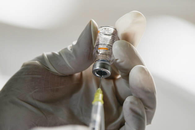 (210223) -- ECATEPEC, Feb. 23, 2021 -- A medical worker prepares a dose of COVID-19 vaccine developed by Chinese pharmaceutical company Sinovac at a vaccination site in Ecatepec, Mexico, Feb. 22, 2021. Mexican health authorities on Monday began to vaccinate older adults with a COVID-19 vaccine developed by Chinese pharmaceutical company Sinovac, after a shipment of doses arrived on Saturday. Mexico s government designated the first shipment of the Sinovac vaccine to arrive in Ecatepec, a city in central State of Mexico that lies on the outskirts of the capital Mexico City. Early in the day, brigades of healthcare workers began to administer the vaccine to hundreds of residents aged 60 and over who went to the Las Americas cultural 