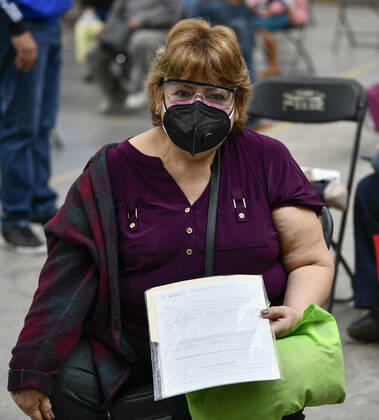 (210223) -- ECATEPEC, Feb. 23, 2021 -- A woman holds a certificate of injection of the COVID-19 vaccine developed by Chinese pharmaceutical company Sinovac at a vaccination site in Ecatepec, Mexico, Feb. 22, 2021. Mexican health authorities on Monday began to vaccinate older adults with a COVID-19 vaccine developed by Chinese pharmaceutical company Sinovac, after a shipment of doses arrived on Saturday. Mexico s government designated the first shipment of the Sinovac vaccine to arrive in Ecatepec, a city in central State of Mexico that lies on the outskirts of the capital Mexico City. Early in the day, brigades of healthcare workers began to administer the vaccine to hundreds of residents aged 60 and over who went to the Las Americ 