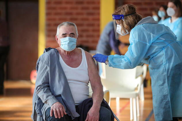 Vaccination in Zagreb, Croatia A man receive coronavirus disease (COVID-19) vaccine during a mass vaccination in Zagreb, Croatia on February 23, 2021 SanjinxStrukic PIXSELL