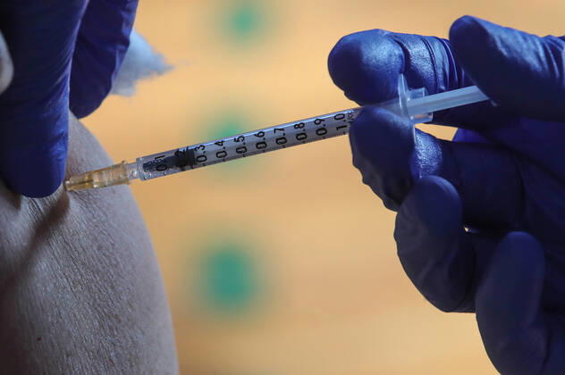 Vaccination in Zagreb, Croatia A man receive coronavirus disease (COVID-19) vaccine during a mass vaccination in Zagreb, Croatia on February 23, 2021 SanjinxStrukic PIXSELL