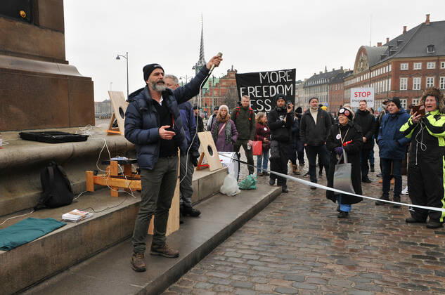 Copenhagen, Denmark. 23 February 2021, Danes proetesting againest coronavirus pandemic new debate in danish parliamenet about quick corona virus pandemic law in danish parliament with all political parties and stage anti pandemic law debates in front of danish parliament and danish police stand peaceful proteact danish parliament in front christiansborg danish parliament in Copenhagen. (Photo..Francis Dean Deanpictures)