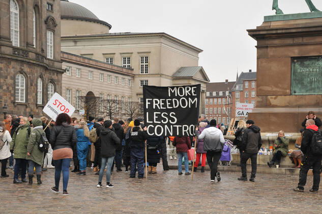 Copenhagen, Denmark. 23 February 2021, Danes proetesting againest coronavirus pandemic new debate in danish parliamenet about quick corona virus pandemic law in danish parliament with all political parties and stage anti pandemic law debates in front of danish parliament and danish police stand peaceful proteact danish parliament in front christiansborg danish parliament in Copenhagen. (Photo..Francis Dean Deanpictures)