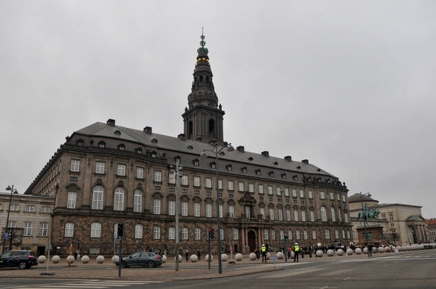 Copenhagen, Denmark. 23 February 2021, Danes proetesting againest coronavirus pandemic new debate in danish parliamenet about quick corona virus pandemic law in danish parliament with all political parties and stage anti pandemic law debates in front of danish parliament and danish police stand peaceful proteact danish parliament in front christiansborg danish parliament in Copenhagen. (Photo..Francis Dean Deanpictures)