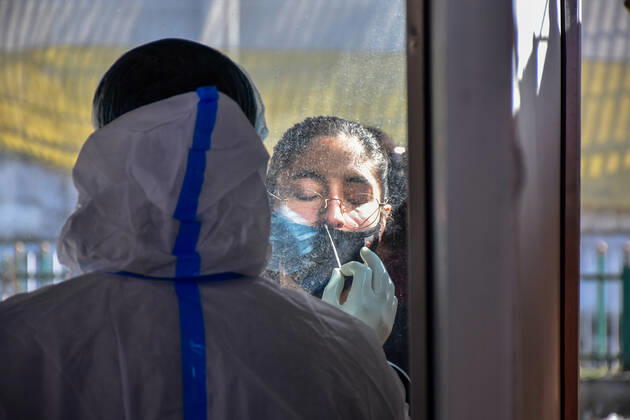 February 23, 2021, Srinagar, India: A health worker takes a nasal swab of a girl for a Covid-19 test at a coronavirus testing center in Srinagar..Jammu and Kashmir recorded 58 new COVID-19 cases which took the infection tally to 125,925, officials said. A senior doctor has warned of a second wave of COVID 19 infections, the warning has come at a time when Kashmir valley is witnessing a sharp decrease in daily cases. Srinagar India - ZUMAs197 20210223_zaa_s197_023 Copyright: xSaqibxMajeedx