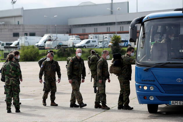 February 23, 2021, Lisbon, Portugal: German army medical experts get into a in a bus at Figo Maduro military airbase in Lisbon, Portugal on February 23, 2021. Based on a bilateral agreement, a second team of German army medical experts arrived in Portugal on Tuesday to replace the team that has been in Portugal since February 3 to assist the country in its fight against the COVID-19 pandemic. Lisbon Portugal - ZUMAf123 20210223_zap_f123_009 Copyright: xPedroxFiuzax