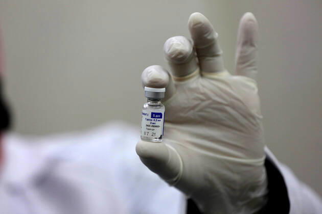 February 23, 2021, Khan Yunis, Gaza Strip, Palestinian Territory: A Palestinian health worker prepares a shot of the Russian Sputnik V coronavirus vaccine at European Hospital, in Khan Yunis, in the southern Gaza Strip on February 23, 2021. Around 20,000 coronavirus vaccine doses from the UAE arrived in Gaza, a delivery reportedly orchestrated by a rival of Palestinian president Mahmud Abbas three months before scheduled Palestinian elections Khan Yunis Palestinian Territory - ZUMAap3_ 20210223_zaf_ap3_045 Copyright: xAshrafxAmrax