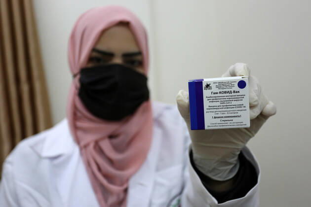 February 23, 2021, Khan Yunis, Gaza Strip, Palestinian Territory: A Palestinian health worker displays a box of the Russian Sputnik V coronavirus vaccine at European Hospital, in Khan Yunis, in the southern Gaza Strip on February 23, 2021. Around 20,000 coronavirus vaccine doses from the UAE arrived in Gaza, a delivery reportedly orchestrated by a rival of Palestinian president Mahmud Abbas three months before scheduled Palestinian elections Khan Yunis Palestinian Territory - ZUMAap3_ 20210223_zaf_ap3_052 Copyright: xAshrafxAmrax