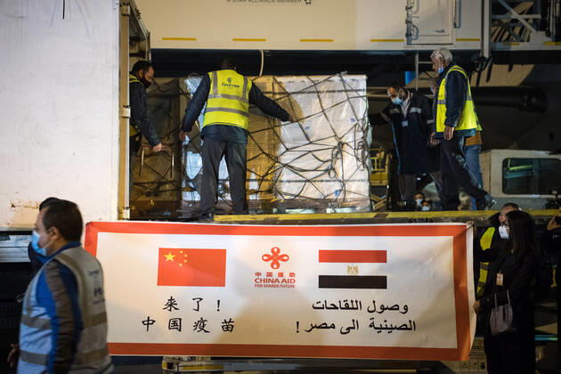 (210223) -- CAIRO, Feb. 23, 2021 -- Workers upload a batch of China s Sinopharm COVID-19 vaccines onto a truck in Cairo International Airport, Egypt, Feb. 23, 2021. The shipment of COVID-19 vaccines from Chinese company Sinopharm arrived in Egyptian capital Cairo on Tuesday. ) EGYPT-CAIRO-CHINA-VACCINE-ARRIVAL WuxHuiwo