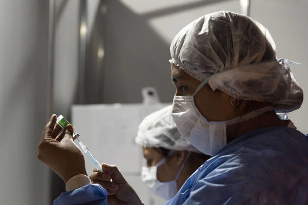 February 23, 2021, City of Buenos Aires, City of Buenos Aires, Argentina: INT. WorldNews. COVID-19. February 23, 2021. City of Buenos Aires, Argentina.- Two nurses prepare the vaccine injection for SARS CoV2 (COVID-19) on Feb 23, 2021, at a temporary Vaccination Center at Centro Cultural Recoleta, City of Buenos Aires, Argentina..Adults over 80 years old are being vaccinated for SARS CoV2 (COVID-19) since Feb 22, 2021 in City of Buenos Aires. City of Buenos Aires Argentina - ZUMAf135 20210223_zap_f135_008 Copyright: xJulietaxFerrariox