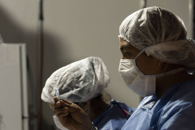 February 23, 2021, City of Buenos Aires, City of Buenos Aires, Argentina: INT. WorldNews. COVID-19. February 23, 2021. City of Buenos Aires, Argentina.- Two nurses prepare the vaccine injection for SARS CoV2 (COVID-19) on Feb 23, 2021, at a temporary Vaccination Center at Centro Cultural Recoleta, City of Buenos Aires, Argentina..Adults over 80 years old are being vaccinated for SARS CoV2 (COVID-19) since Feb 22, 2021 in City of Buenos Aires. City of Buenos Aires Argentina - ZUMAf135 20210223_zap_f135_009 Copyright: xJulietaxFerrariox