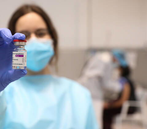 A health professional holds a vial with the vaccine against COVID-19 from AstraZeneca, in the Pavilion 3 of the Public Hospital Enfermera Isabel Zendal, in Madrid, (Spain), on February 23, 2021. This Tuesday begins the vaccination in the pavilion 3 of the hospital with the vaccine of AstraZeneca to 400 people of External Health, AENA, inspectors of Public Health, of Institute of Social Security, professionals of reformatories, Forensic Doctors, Students of CC Health and veterinarians. These new groups to be vaccinated will be joined by those over 80 years of age on Thursday 25 February in the Primary Care centres of each of the health areas of the community with 50,000 doses. 23 FEBRUARY 2021;ISABEL DÃAZ AYUSO;AYUSO;MADRID;COMMUNITY OF MAD Copyright: xLagenciaEPxPRESS M.FERNÃNDEZ.xPOOLx 3576562