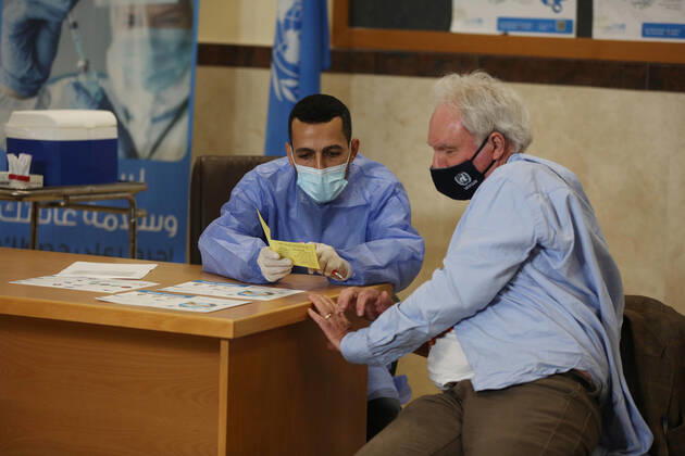 February 24, 2021, Gaza city, Gaza Strip, Palestinian Territory: Director of UNRWA Affairs in Gaza strip, Matthias Schmale, receives a dose of coronavirus disease (COVID-19) vaccine at a UN clinic in Gaza City, on February 24, 2021. Palestinians in Gaza began a limited COVID-19 vaccination programme on Monday after receiving doses donated by Russia and the United Arab Emirates, but a wider campaign could be further off as health officials await larger shipments Gaza city Palestinian Territory - ZUMAap3_ 20210224_zaf_ap3_013 Copyright: xAshrafxAmrax
