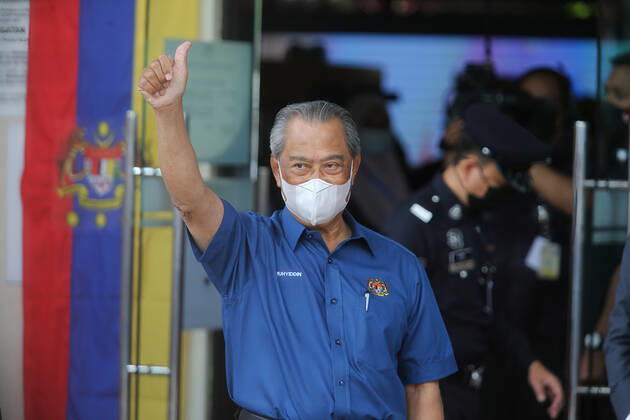February 20, 2021, Putrajaya, Malaysia: Prime Minister, Muhyiddin Yassin raises a thumb on arrival at a health district office for the first dose of Pfizer-BioNTech COVID-19 Vaccine in Putrajaya..Malaysia will launch the largest immunization program ever to be carried out in the country. 532 Vaccination Centers nationwide are set to begin the National COVID-19 Immunization Program starting February 24, 2021. The first phase will involve 500,000 medical staff and non-medical staff. Putrajaya Malaysia - ZUMAs197 20210220_zaa_s197_457 Copyright: xCalvinxPanx