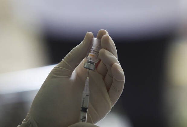 COVID-19 vaccination Second phase to In Bogor, Indonesia A medical worker prepares to inject a dose of COVID-19 vaccine during a mass vaccination in Bogor on February 25, 2021. Indonesia has started the second phase of a national COVID-19 vaccination campaign, one million people in Indonesia have been inject a vaccine. 