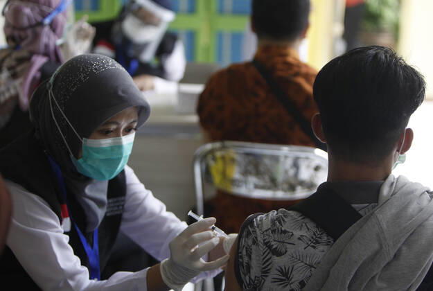 COVID-19 vaccination Second phase to In Bogor, Indonesia A health worker get inject a dose of COVID-19 vaccine during a mass vaccination in Bogor on February 25, 2021. Indonesia has started the second phase of a national COVID-19 vaccination campaign, one million people in Indonesia have been inject a vaccine. 