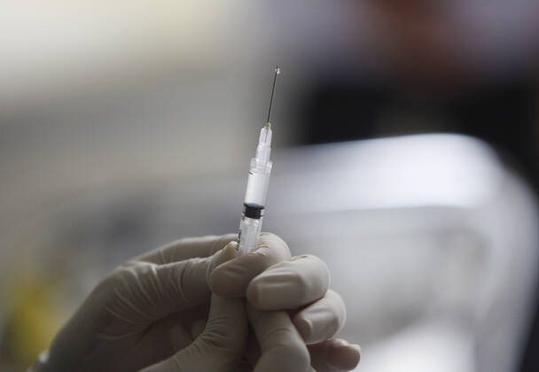 COVID-19 vaccination Second phase to In Bogor, Indonesia A medical worker prepares to inject a dose of COVID-19 vaccine during a mass vaccination in Bogor on February 25, 2021. Indonesia has started the second phase of a national COVID-19 vaccination campaign, one million people in Indonesia have been inject a vaccine. 