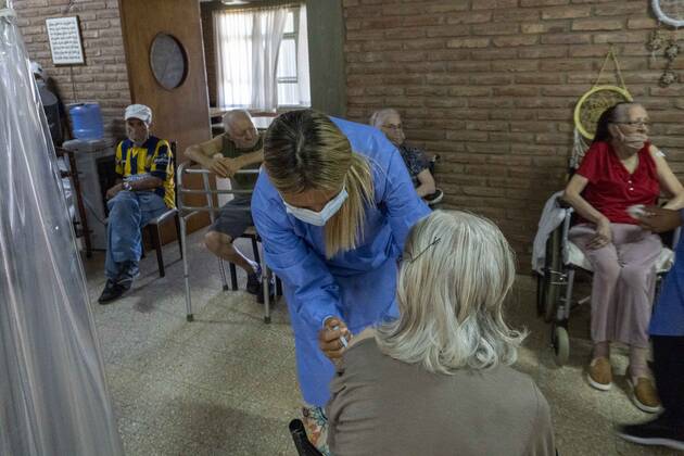 February 25, 2021, Firmat, Santa Fe, Argentina: A nurse applies a shot of India s Serum Institute Covishield vaccine against COVID-19 to and elderly woman inside a makeshift care home functioning in a special school. The original care home inside San Martin Hospital was converted into the COVID-19 sector at the beginning of the pandemic, and the residents were moved into this location. Firmat Argentina - ZUMAm105 20210225_zaf_m105_001 Copyright: xPatricioxMurphyx