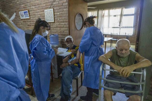 February 25, 2021, Firmat, Santa Fe, Argentina: A nurse applies a shot of India s Serum Institute Covishield vaccine against COVID-19 to and elderly man inside a makeshift care home functioning in a special school. The original care home inside San Martin Hospital was converted into the COVID-19 sector at the beginning of the pandemic, and the residents were moved into this location. Firmat Argentina - ZUMAm105 20210225_zaf_m105_003 Copyright: xPatricioxMurphyx