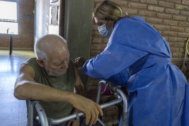 February 25, 2021, Firmat, Santa Fe, Argentina: A nurse applies a shot of India s Serum Institute Covishield vaccine against COVID-19 to and elderly man inside a makeshift care home functioning in a special school. The original care home inside San Martin Hospital was converted into the COVID-19 sector at the beginning of the pandemic, and the residents were moved into this location. Firmat Argentina - ZUMAm105 20210225_zaf_m105_006 Copyright: xPatricioxMurphyx