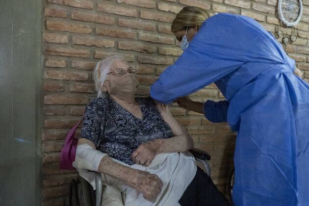 February 25, 2021, Firmat, Santa Fe, Argentina: A nurse applies a shot of India s Serum Institute Covishield vaccine against COVID-19 to and elderly woman inside a makeshift care home functioning in a special school. The original care home inside San Martin Hospital was converted into the COVID-19 sector at the beginning of the pandemic, and the residents were moved into this location. Firmat Argentina - ZUMAm105 20210225_zaf_m105_008 Copyright: xPatricioxMurphyx