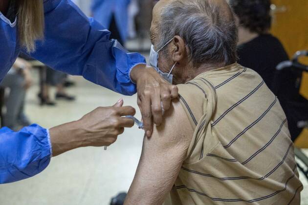 February 25, 2021, Firmat, Santa Fe, Argentina: A nurse applies a shot of India s Serum Institute Covishield vaccine against COVID-19 to and elderly man inside a makeshift care home functioning in a special school. The original care home inside San Martin Hospital was converted into the COVID-19 sector at the beginning of the pandemic, and the residents were moved into this location. Firmat Argentina - ZUMAm105 20210225_zaf_m105_009 Copyright: xPatricioxMurphyx
