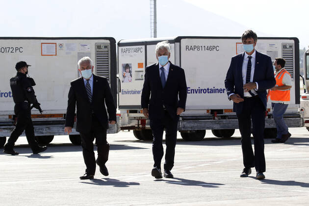 Santiago 25 February 2021 The President of the Republic Sebastian Pinera accompanied by Health Minister Enrique Pairis and Science Minister Andres Couve receive third shipment of Sinovac vaccine against Covid 19, at Arturo Merino Benitez airport Javier Salvo Aton Chile, Santiago Chile Aton Chile 490929  Copyright: JAVIERxSALVO ATONCHILE